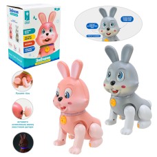 Зайченя музичне 13х9х17 см зі світлом, українською озвучкою та рухомими деталями, співає пісню, на батарейці, у коробці 14х9,7х17 см